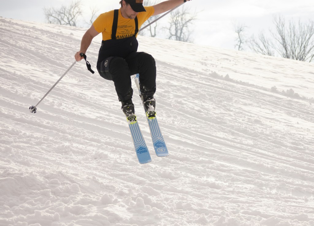 Action shot of skiier jumping in the Japan ski area of Myoko Kogen which is in Niigata Japan.