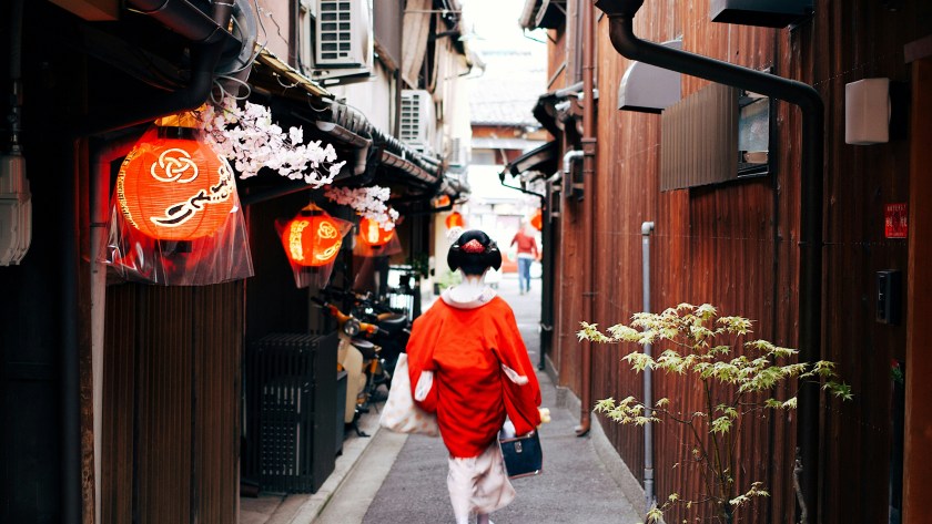 Geisha walking through Gion district, one of the top cultural attractions in Kyoto Japan