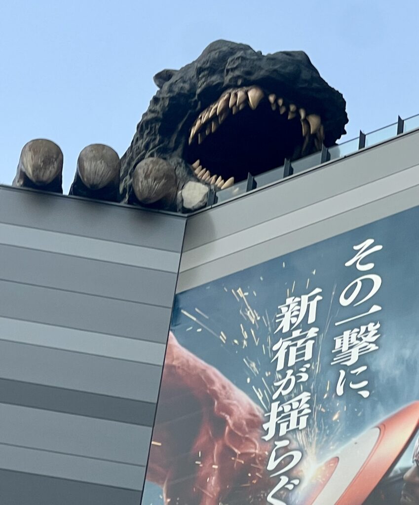 Godzilla head sculpture on rooftop of Gracery Shinjuku hotel in Tokyo