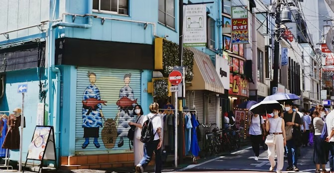 street in Shimokitazawa Tokyo during the day with shops and pedestrians