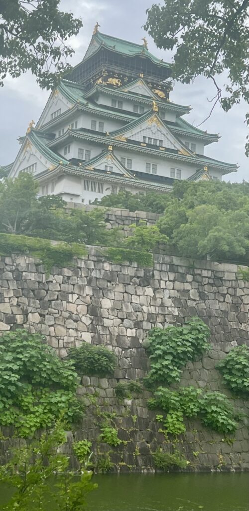 Osaka Castle surrounded by stone walls and moat in Osaka Japan on a 10-day Japan itinerary
