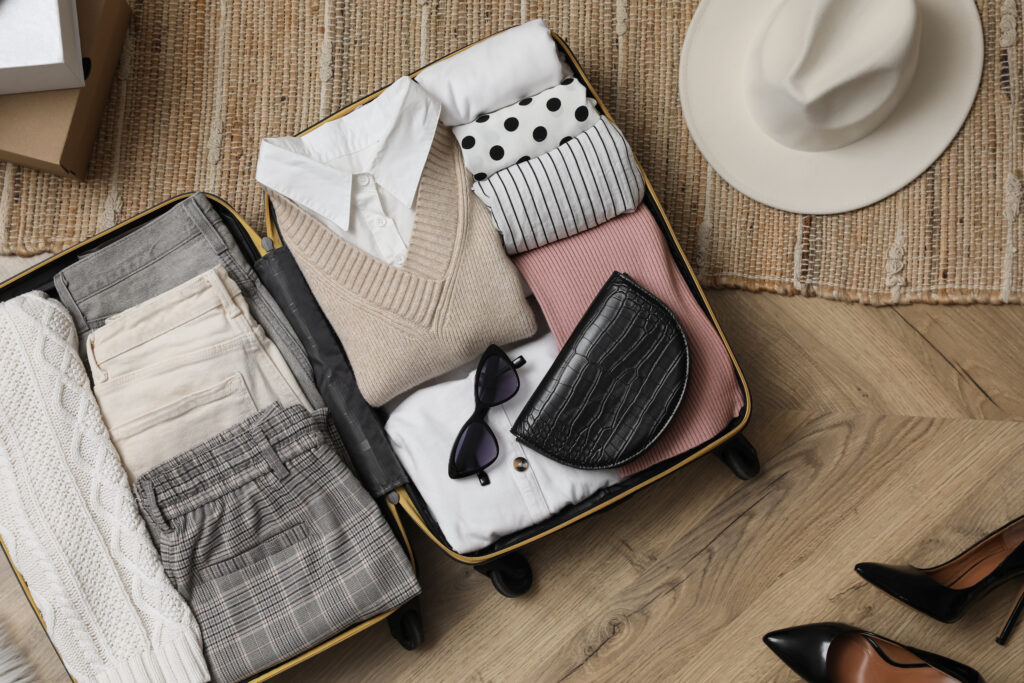 Japan packing list essentials neatly organized in suitcase with packing cubes and travel accessories for a Japan trip