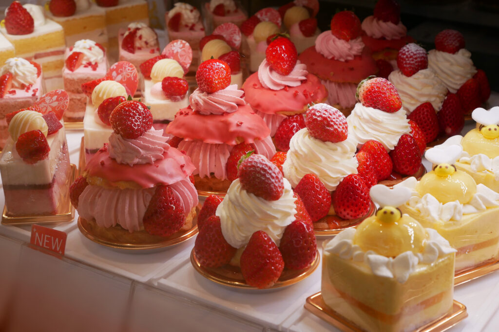 Beautiful strawberry cakes and desserts displayed in a Tokyo depachika department store food hall