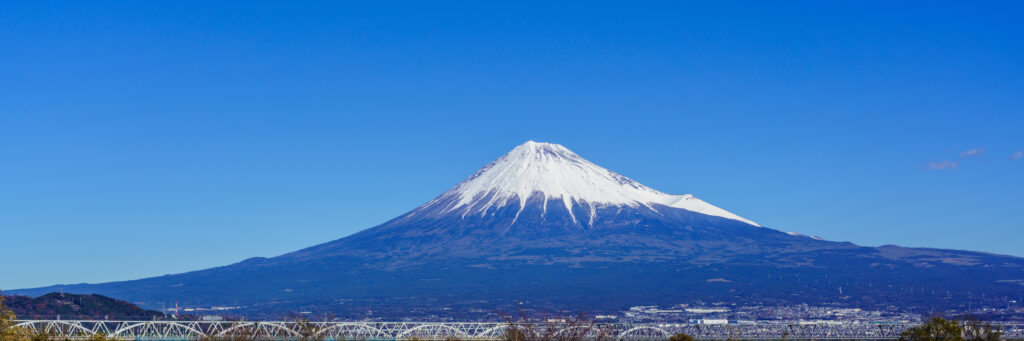 View of Mount Fuji from the Hakone Ropeway above Owakudani volcanic valley in Japan.